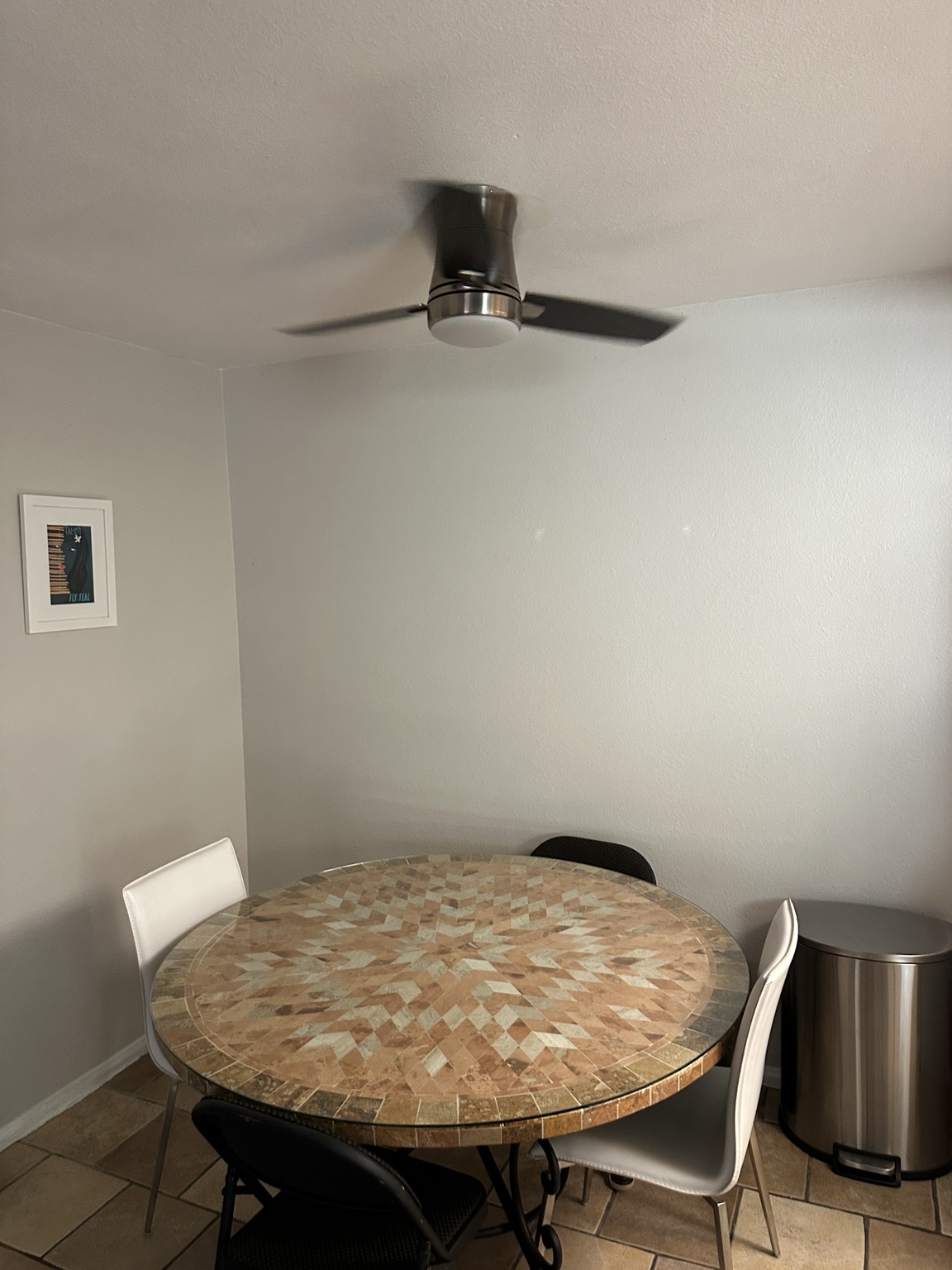 Completed modern ceiling fan above a dining area