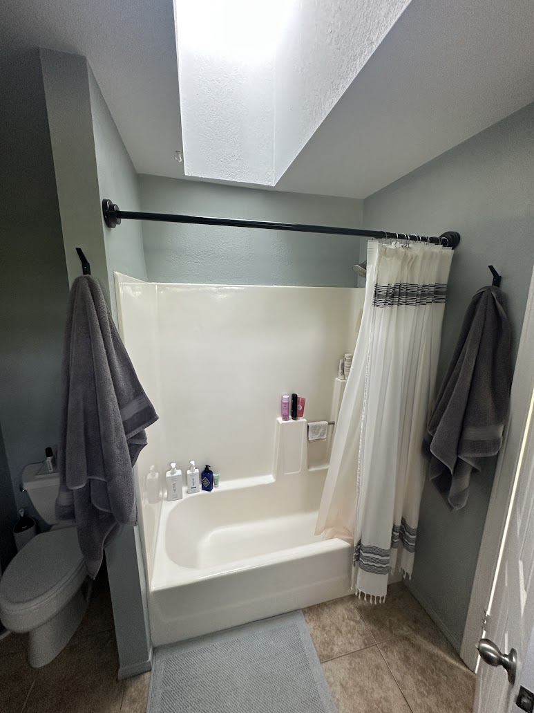 Vista master bathroom with tub and low soffit before renovation