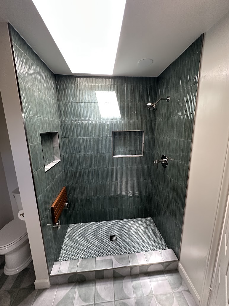 Tiled walk-in shower with recessed niches in Vista master bathroom