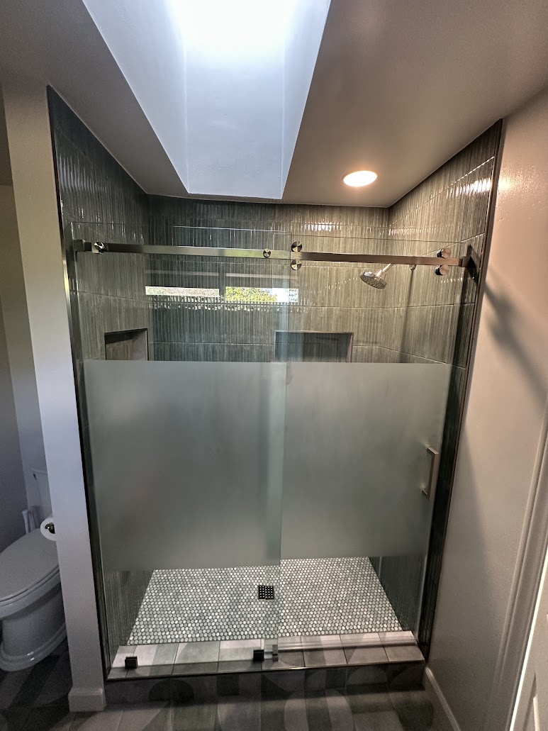 Vista tub-to-shower conversion with finished glass shower enclosure
